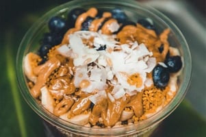 breakfast cup with blueberries, bananas coconut and nut butter